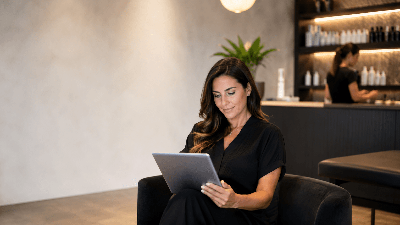 Business owner reviewing performance reports on a tablet.